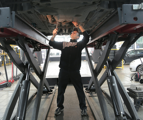 Mechanic repairing car.